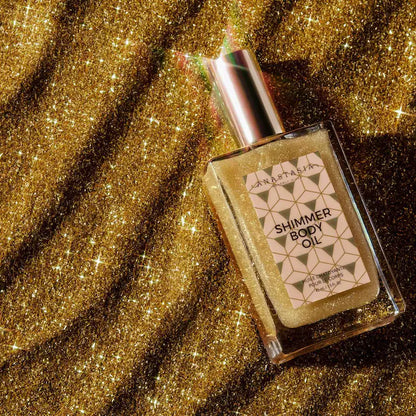 Shimmer Body Oil - Anastasia Beverly Hills vista frontal con fondo blanco.